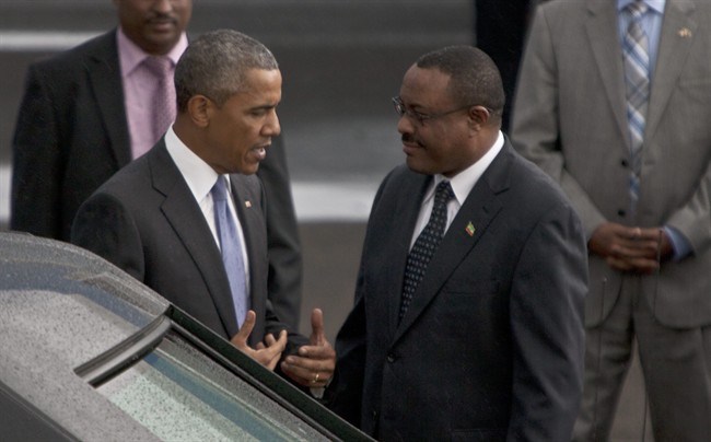 President Barack Obama with Ethiopian prime minister Hailemariam Desalegn, right, at Bole International Airport Addis Ababa , Ethiopia, Sunday July 26, 2015. Obama is traveling on a two-nation African tour where he will become the the first sitting U.S. president to visit Kenya and Ethiopia. (AP Photo / Sayyid Azim).
