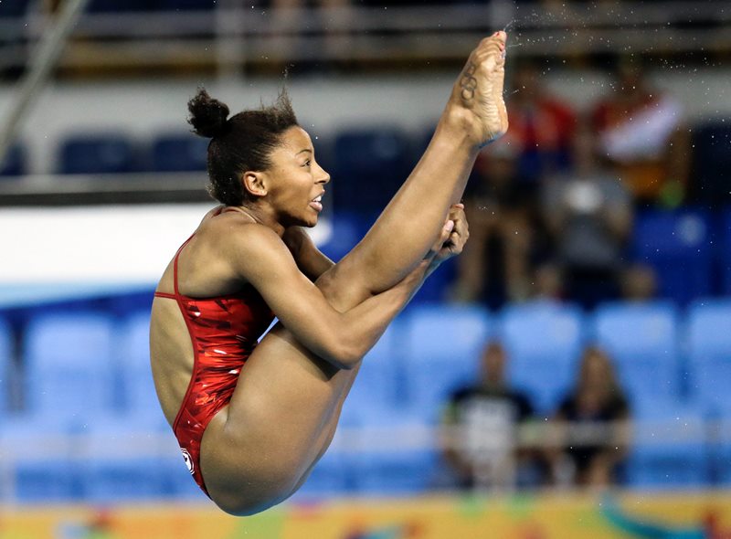 Jennifer Abel of Canada dives during the final round of the women's 3-meter springboard event at the Pan Am Games Sunday, July 12, 2015, in Toronto. Abel won the gold medal in the event. 