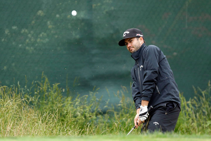 Adam Hadwin, of Canada, chips on the seventh hole during the first round of the U.S. Open golf tournament at Merion Golf Club, Friday, June 14, 2013, in Ardmore, Pa.