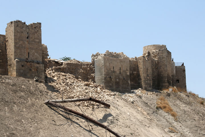 A picture taken on July 12, 2015, shows a damaged wall of Aleppo Citadel following a reported explosion the previous night in a tunnel near the monumental 13th century fortress.