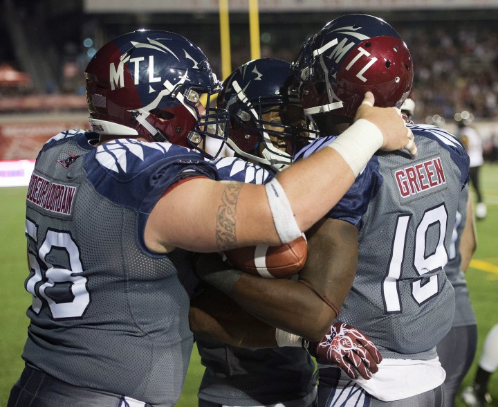 Montreal Alouettes slotback S.J. Green (19) celebrates with teammates after scoring a touchdown during third quarter CFL action Thursday, July 16, 2015 in Montreal.