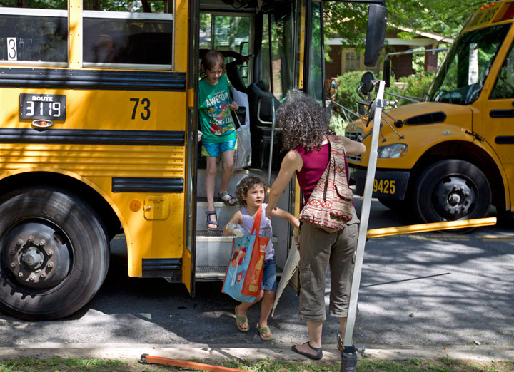 FILE PHOTO: Danielle Meitiv greets her children as they get off the school bus in Silver Spring, Md., Friday, June 12, 2015.