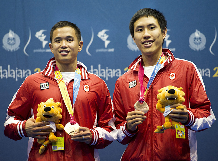 Canadian  men's doubles pair Adrian Liu, left, and Derrick Ng show off their bronze medals in badminton during the 2011 Pan American Games in Guadalajara, Mexico on Wednesday, Oct. 19, 2011.