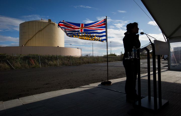 In this 2014 file photo, B.C. Premier Christy Clark is silhouetted as she speaks after a groundbreaking event for FortisBC's Tilbury LNG facility expansion project in Delta, B.C.
