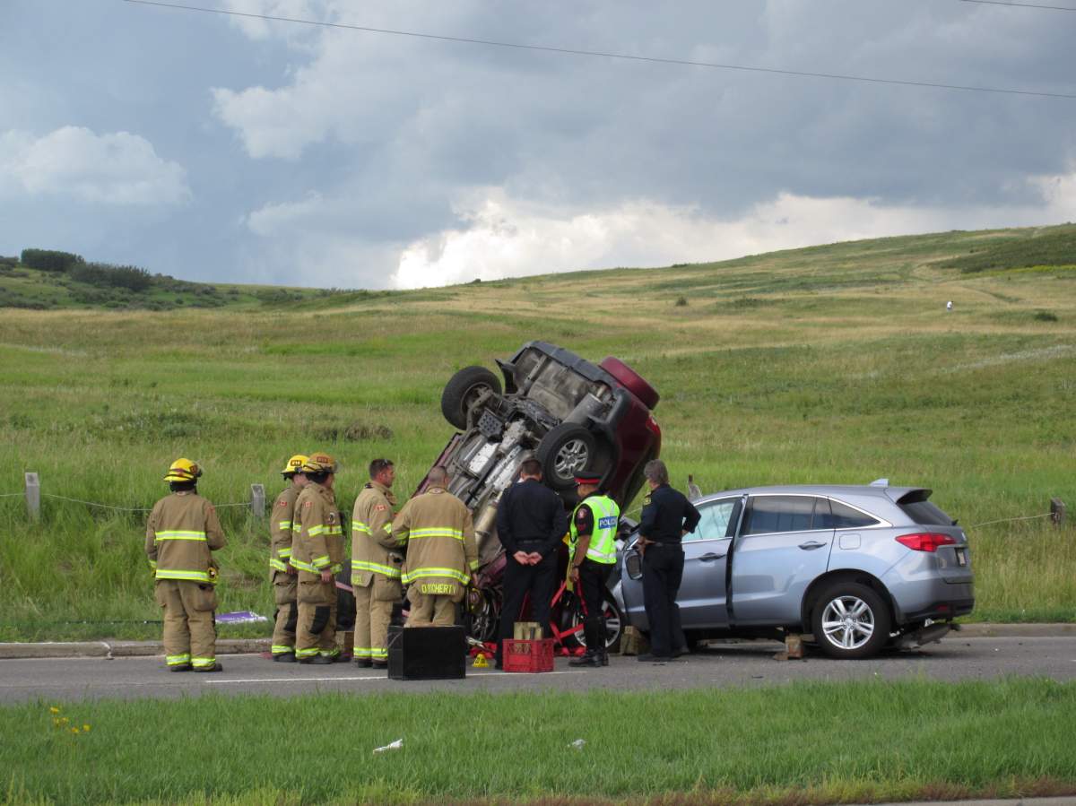 Emergency crews investigate a fatal crash in the intersection of Berkley Gate N.W. and 14th Street N.W.