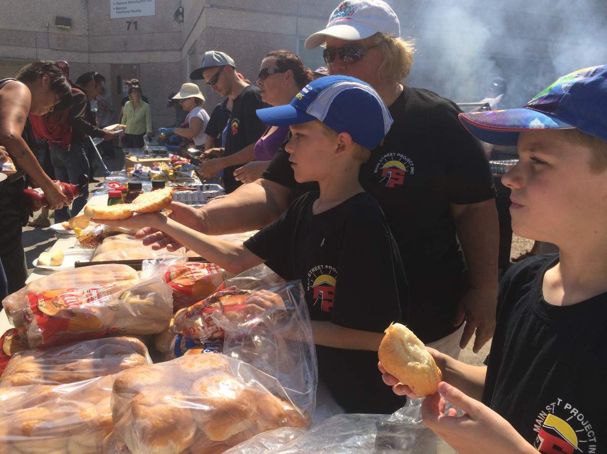Brady McQueen serves a hot meal to 600 of Winnipeg's homeless Saturday afternoon.