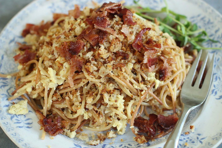 This June 22, 2015 photo shows breakfast for dinner spaghetti in Concord, N.H. This dish is from a recipe by Sara Moulton.