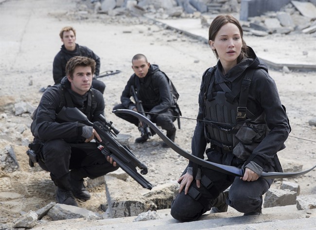 This photo provided by Lionsgate, shows, Liam Hemsworth, front left, as Gale Hawthorne, Sam Claflin, back left, as Finnick Odair, Evan Ross, back right, as Messalla and Jennifer Lawrence as Katniss Everdeen, in ‘The Hunger Games: Mockingjay – Part 2.’