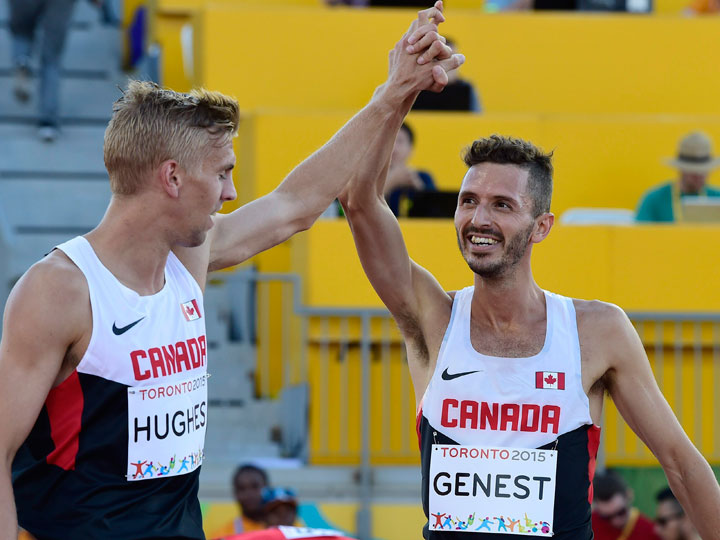 Alexandre Genest, second place, right, and fellow Canadian Matt Hughes, first place, celebrate after the men's 3000m steeplechase final during the athletics competition at the 2015 Pan Am Games in Toronto on Tuesday, July 21, 2015.