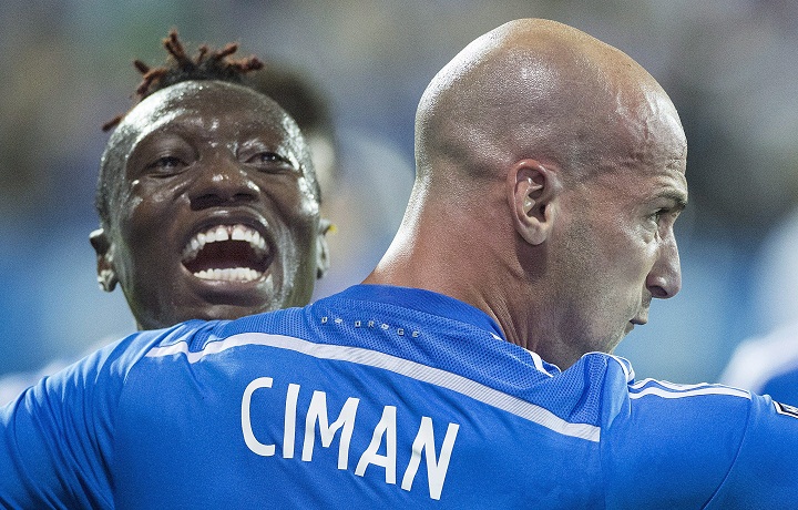 Montreal Impact's Laurent Ciman, right, celebrates with teammate Dominic Oduro after scoring against the Seattle Sounders during second half MLS soccer action in Montreal, Saturday, July 25, 2015.