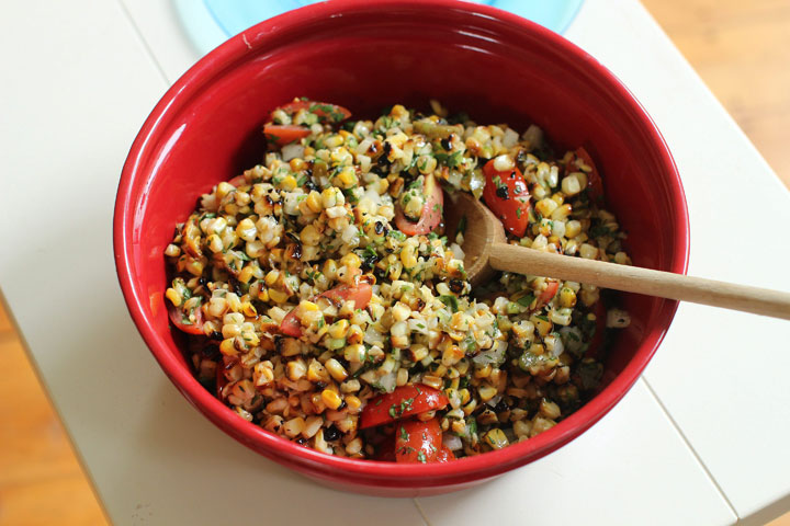 This June 1, 2015 photo shows blistered corn salad in Concord, N.H. This dish is from a recipe by Elizabeth Karmel.