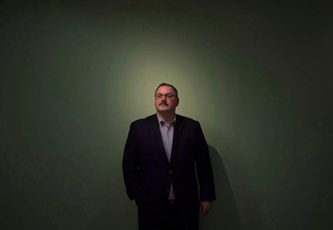 Ronald Boire poses at the Sears Canada headquarters in Toronto on November 12, 2014. 