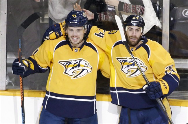 The Edmonton Oilers signed winger Taylor Beck (L) to a one-year contract on Sunday.