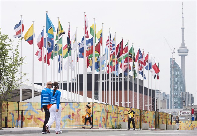 Flags of the participating countries fly in the athletes' village as the CN Tower stands in the background at the 2015 Pan American Games in Toronto on July 9, 2015. 