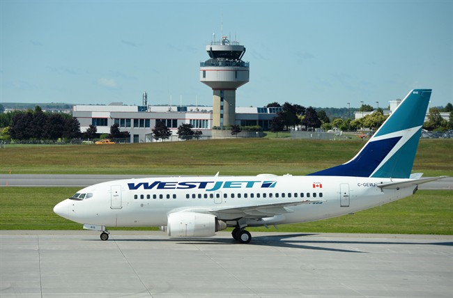 A WestJet aircraft is pictured on the tarmac in Ottawa.