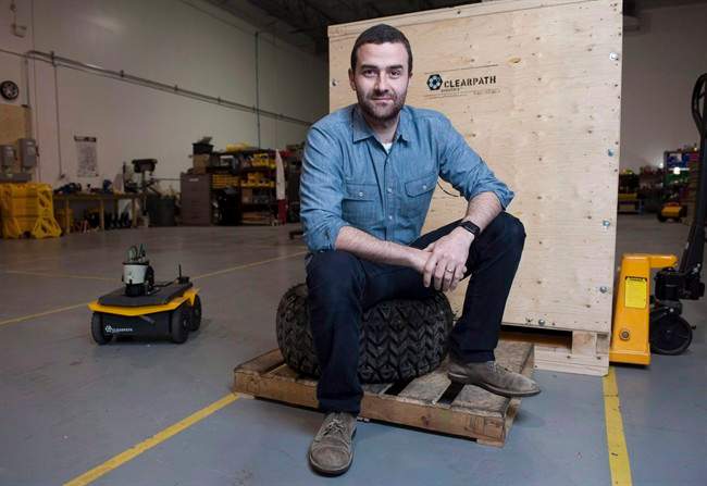 Clearpath Robotics CEO Matt Rendall poses for a portrait at the Clearpath Robotics warehouse in Kitchener, Ont., on Thursday, Dec. 18, 2014. Canadian robot manufacturer Clearpath Robotics is rolling into Silicon Valley with a new office. 