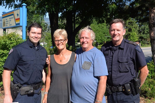 RCMP Cst. Bobinski, left to right, Lynne Carmody and Rick Moynan of North Bay, Ont., and RCMP Cpl. Brian Burke pose for a photo in this undated handout photo. An Ontario couple rescued after spending six days lost in the British Columbia wilderness say they've been through a humbling experience and want to thank the searchers who looked for them.