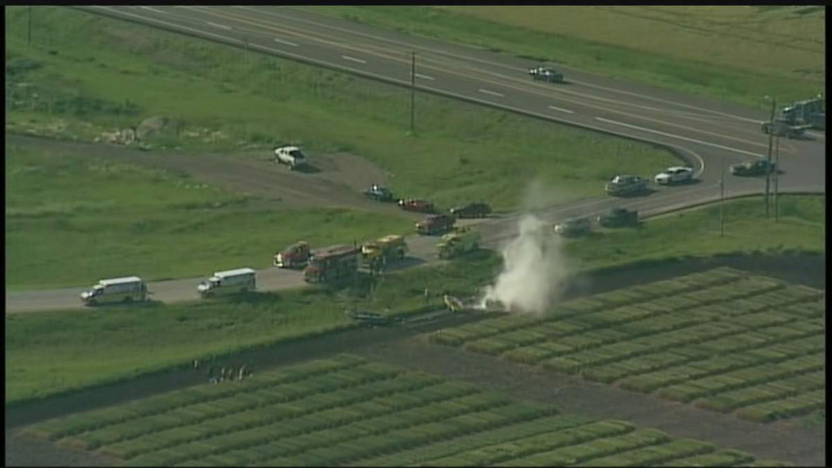 Smoke can be seen billowing from a half tonne truck after crashing near Warren, Manitoba.