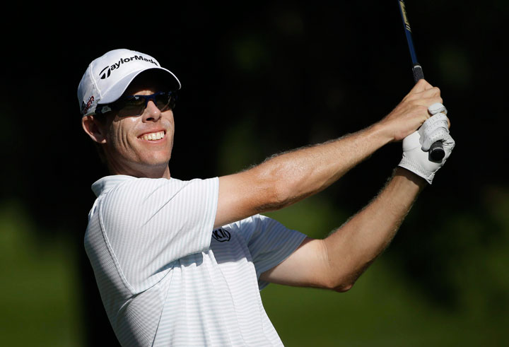 David Hearn, of Canada, watches his shot from the eighth tee during the second round of The Players Championship golf tournament Friday, May 8, 2015, in Ponte Vedra Beach, Fla.