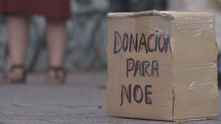 A donation box for Noé Arteaga Santos sits on the ground at the “Reparations for Noé” rally in Montreal on Sunday, July 19, 2015.