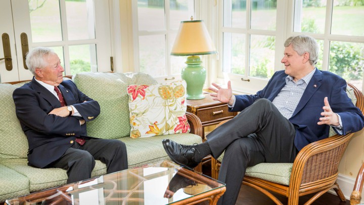 Michel Doyon, new Lieutenant Govenor of Quebec, sits with Canadian Prime Minister Stephen Harper, Tuesday, July 21, 2015.