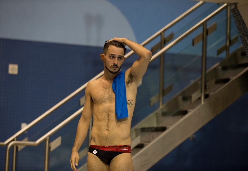 Canada's Francois Imbeau-Dulac leaves the pool after his final dive during the men's 3-meter springboard event at the Pan Am Games in Toronto, Friday, July 10, 2015. 
