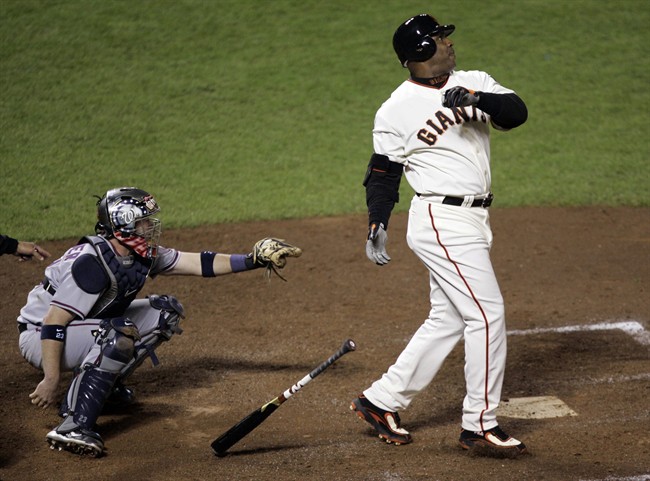 FILE - In this Tuesday, Aug. 7, 2007, file photo, San Francisco Giants Barry Bonds hits his 756th career home run in the fifth inning of a baseball game against the Washington Nationals in San Francisco.