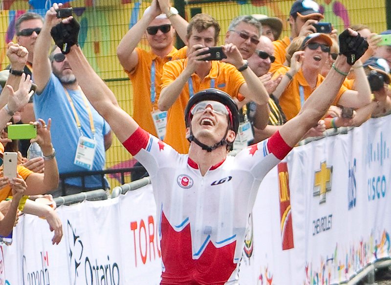 Raphael Gagne reacts as he crosses the finish line to win gold for Canada at the Hardwood Mountain Bike Park in Oro-Medonte, Ont. in the final of the men's mountain bike event at the 2015 Pan American Games on Sunday, July 12, 2015. 