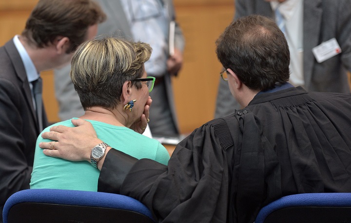 Viviane Lambert (L) reacts after a hearing in the case of her son, Vincent, a quadriplegic man who is currently on artificial life support in a hospital in Reims, at the European Court of Human Rights in the eastern French city of the Strasbourg on June 5, 2015.