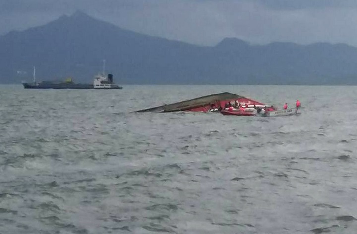Rescuers search for survivors next to the capsized passenger ferry off Ormoc City, central Philippines on July 2, 2015.