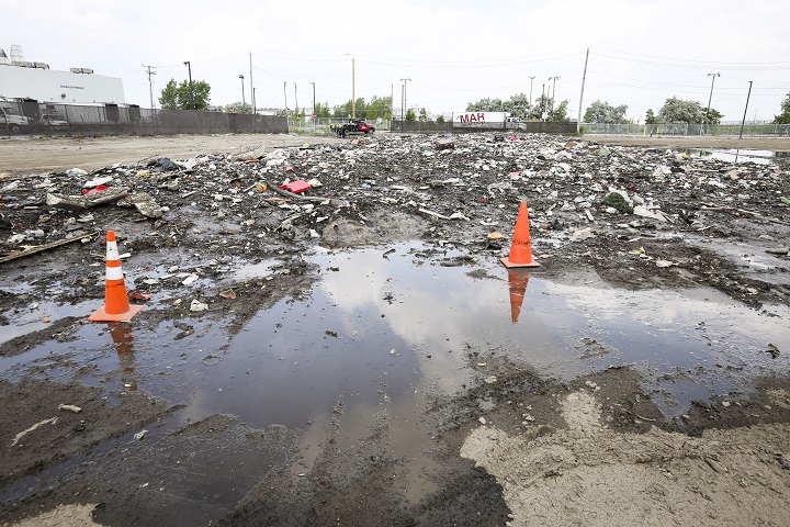 Garbage sits on top of the ice pile that remains of snow that was piled up from the city's winter snow storms in Boston, Massachusetts, July 8, 2015.  (Keith Bedford/Globe Staff).