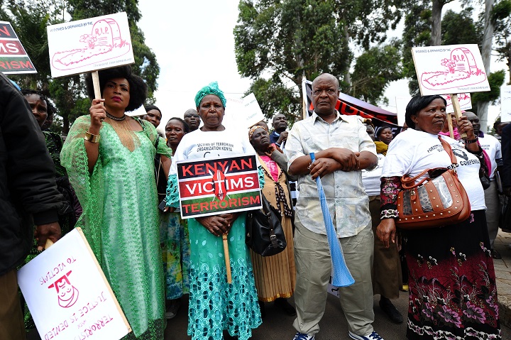 August 1998 bomb blast victims gather at the August 7th Memorial Park, during a peaceful march to deliver a petition to the American Embassy in the Kenyan capital Nairobi, on July 15, 2015 demanding compensation and accusing the US government of turning 'a deaf ear'  to their suffering. 