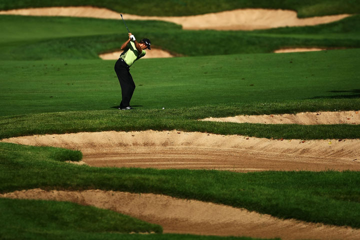 Retief Goosen of South Africa plays his second shot on the 17th hole during round three of the RBC Canadian Open at Glen Abbey Golf Club on July 26, 2009 in Oakville, Ontario.