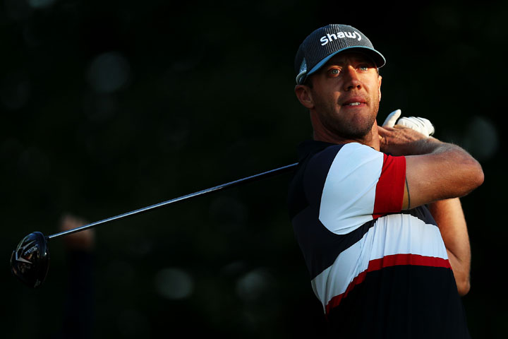 Graham DeLaet plays his shot from the tenth tee during round two of the RBC Canadian Open on July 24, 2015 at Glen Abbey Golf Club in Oakville, Ontario. DeLaet dropped out of the tournament due to a thumb injury.