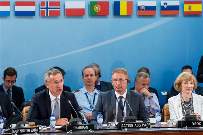 NATO Secretary General Jens Stoltenberg, left, talks during a North Atlantic Council Meeting at NATO headquarters in Brussels on Tuesday July 28, 2015. For just the fifth time in its 66-year history, NATO ambassadors met in emergency session Tuesday to gauge the threat the Islamic State extremist group poses to Turkey, and the debated actions Turkish authorities are taking in response. (AP Photo/Geert Vanden Wijngaert).