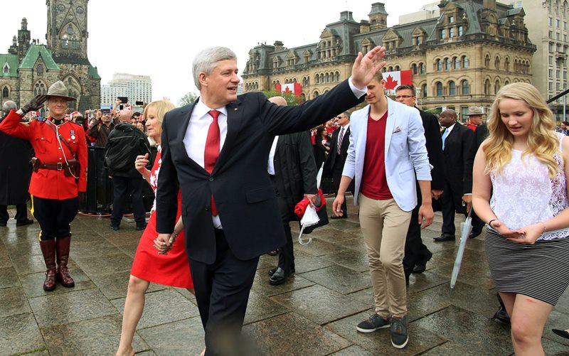 Prime Minister Stephen Harper and his wife Laureen (left) along with Governor General David Johnston and his wife Sharon arrive on Parliament Hill to take part in Canada Day celebrations in Ottawa, Wednesday, July 1, 2015. 