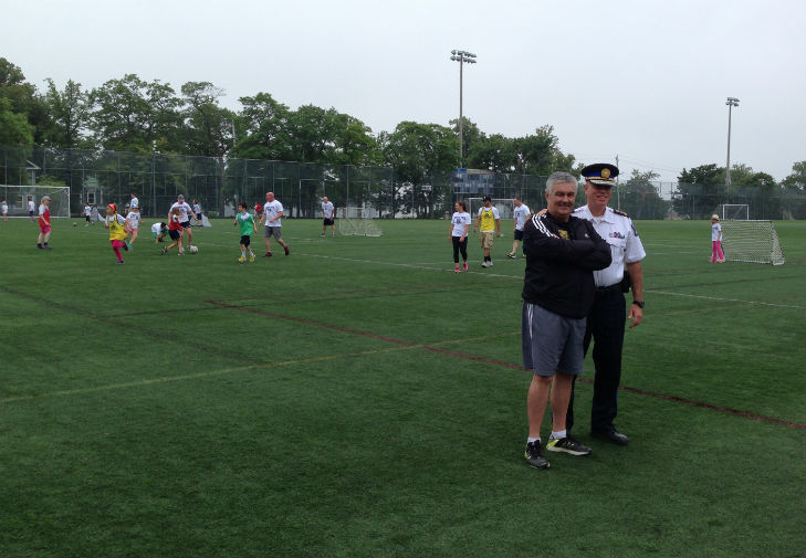 Dalhousie University men's soccer coach Pat Nearing and Halifax Regional Police Chief Jean-Michel Blais on the field at the annual Sports Pals soccer camp.