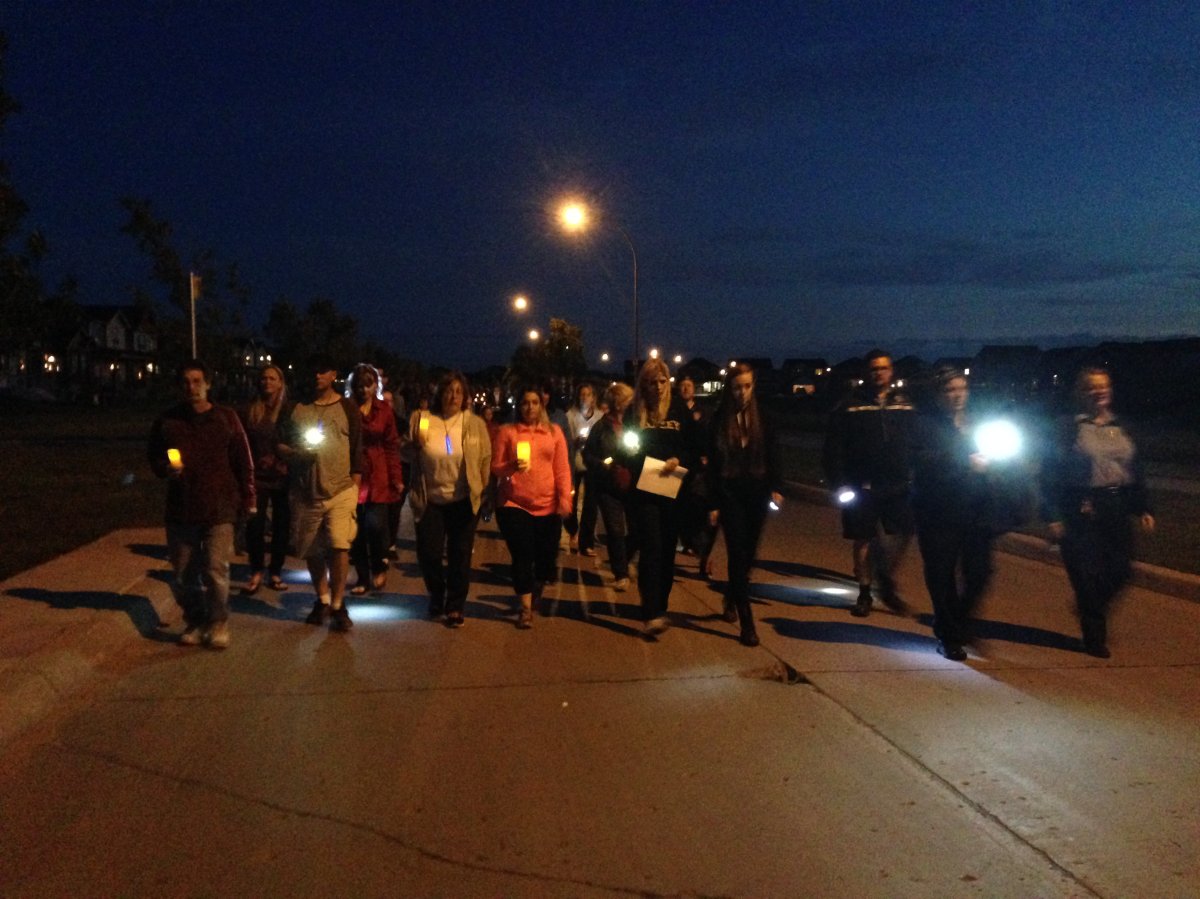 Around 300 people gathered Saturday night for a symbolic walk to light Thelma Krull's way home.