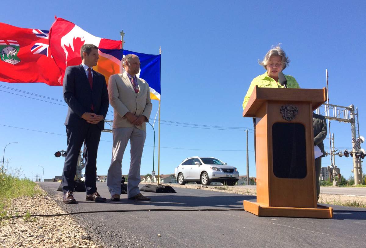 Conservative MP Joyce Bateman is joined by Drew Caldwell, the provincial minis municipal government minister, and Winnipeg Mayor Brian Bowman to announce federal-provincial funding of up to $91.8 million for an underpass on Waverley Street.