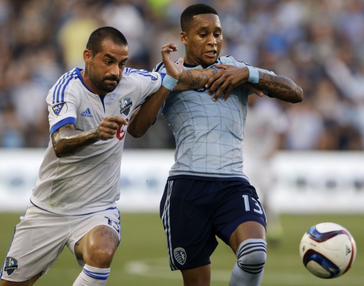 Montreal Impact forward Andres Romero, left, and Sporting Kansas City defender Amadou Dia chases the ball during the first half of an MLS soccer match in Kansas City, Kan., Saturday, July 18, 2015. Sporting KC defeated the Montreal Impact 2-1.
