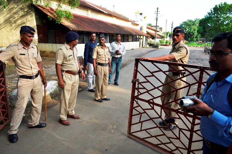 Indian policemen guard outside the Nagpur Central Prison where the 1993 Mumbai blasts convict Yakub Abdul Razak Memon, is currently held in Nagpur, India, Wednesday, July 29, 2015. 