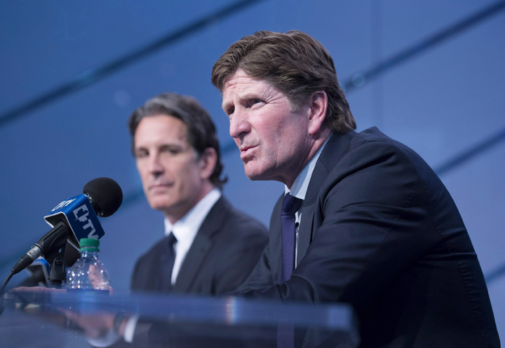 Toronto Maple Leafs new head coach Mike Babcock, right, speaks to reporters with president Brendan Shanahan during a press conference in Toronto on Thursday, May 21, 2015.