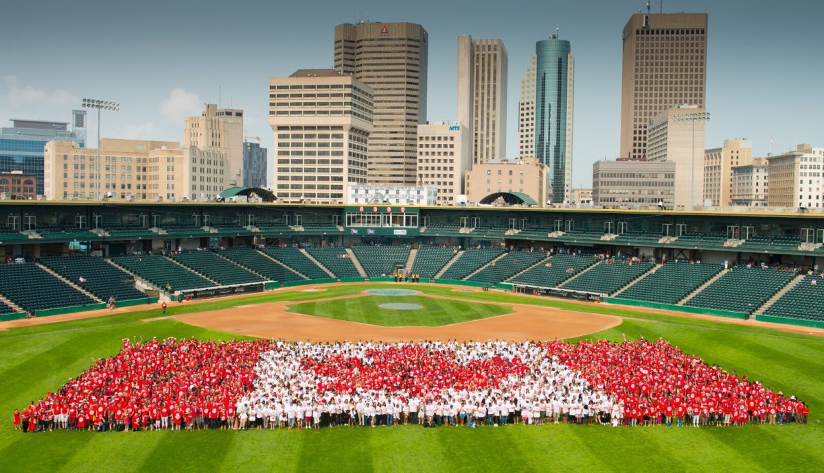 Thousands create Living Canadian Flag at Shaw Park Wednesday morning. 