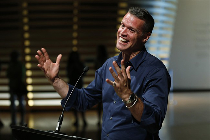Canadian Olympian Mark Tewksbury tells the story of his gold medal win during a news conference at the Canadian Museum For Human Rights on Thursday.