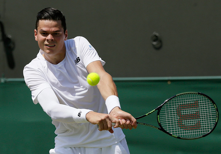 Canada’s Milos Raonic returns a ball to Nick Kyrgios of Australia during their singles match at the All England Lawn Tennis Championships in Wimbledon, London, Friday July 3, 2015. 