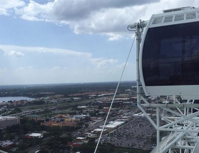 The Ferris wheel known as the Orlando Eye stopped Friday, July 3, 2015, in Orlando, Fla. Authorities say the 400-foot Ferris wheel stopped moving for more than 45 minutes, stranding riders aboard.