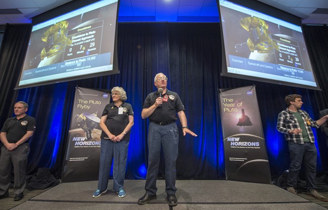 Annette and Alden Tombaugh, the children of American astronomer Clyde Tombaugh who discovered Pluto in 1930, talk at the New Horizons Pluto flyby event, Tuesday, July 14, 2015 at the Johns Hopkins University Applied Physics Laboratory (APL) in Laurel, Md.