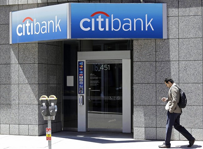 A man walks past a branch of Citibank in the Financial District in San Francisco.