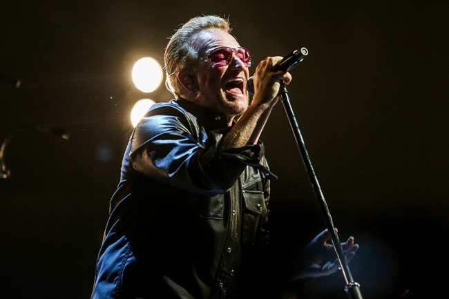 FILE - In this May 26, 2015 file photo, Bono of U2 performs at the Innocence   Experience Tour at The Forum in Inglewood, Calif. 