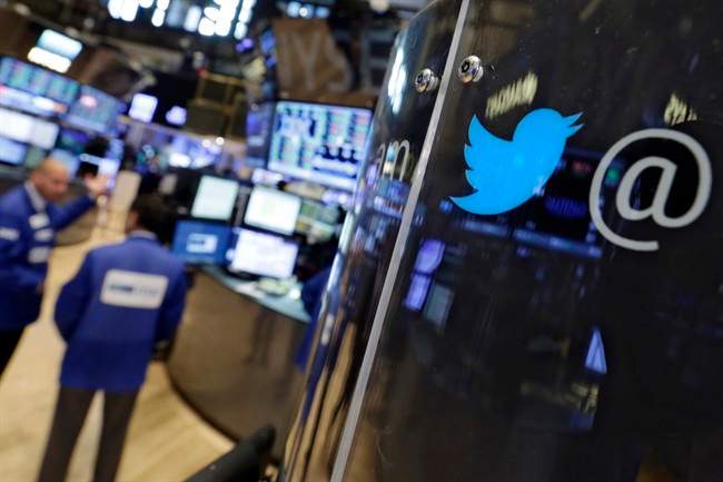 The logo for Twitter adorns a phone post on the floor of the New York Stock Exchange, Tuesday, July 28, 2015. Twitter surprised investors with a strong earnings report Tuesday even as the company searches for a permanent CEO and faces ongoing challenges growing its user base.